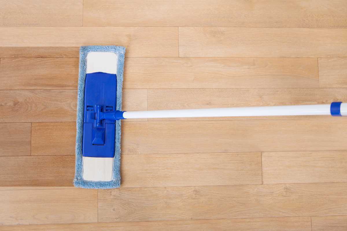 Dust Mop Cleaning Reclaimed Wood Floor