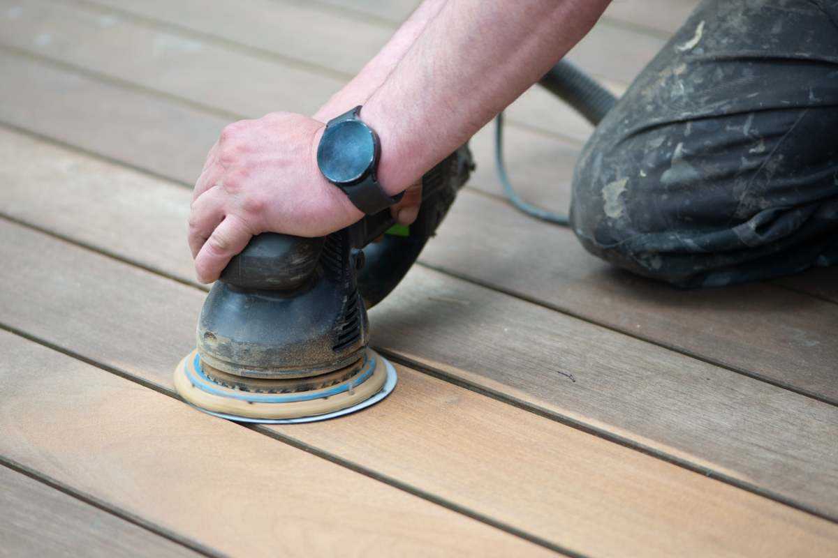 Man Sanding Floor