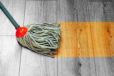 Mopping with water can damage wood flooring Mopping with water can damage wood flooring