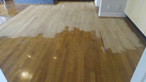 Refinishing a hardwood floor Refinishing a hardwood floor